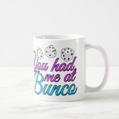 a coffee mug that says you had me at bunco with two dice on it