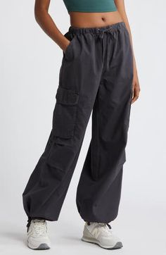 Drawstring-cinched cuffs create a baggy parachute effect in Y2K-inspired cargo pants cut from comfortable cotton and topped with an adjustable waistband. Elastic/drawstring waist Front slant pockets; back hook-and-loop flap-patch pockets; cargo hook-and-loop flap-bellows pockets Drawstring cuffs 100% cotton Machine wash, tumble dry Imported Not available for sale and shipment to Germany Relaxed Fit Cargo Pants With Drawstring For Fall, Cotton Cargo Pants With Elastic Waistband For Outdoor, Cotton Cargo Pants With Elastic Waistband For Outdoor Activities, Cotton Parachute Pants With Elastic Waistband For Outdoor, Wide Leg Cotton Cargo Jeans For Outdoor Activities, Trendy Cotton Cargo Jeans With Drawstring, Cotton Wide Leg Parachute Pants For Outdoor Activities, Sporty Wide Leg Cargo Pants For Fall, Utility Parachute Pants With Drawstring