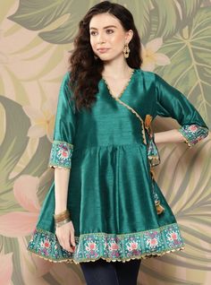 *Teal and golden printed tunic ,has a v-neck, three-quarter sleeves, tie-ups detail,   *Fabric:-  Silk Blend  *Wash Care:-  Hand Wash *Package Contains:- Only One Kurta AVAILABLE IN 7 SIZES THEY ARE IN FOLLOWING MEASUREMENTS IN INCHES:- XXS:- Bust-32/To Fit Waist-26/Length-32/Hip-34 XS:- Bust-34/To Fit Waist-28/Length-32/Hip-36 S:- Bust-36/To Fit Waist-30/Length-32/Hip-38 M:- Bust-38/To Fit Waist-32/Length-32/Hip-40 L:- Bust-40/To Fit Waist-34/Length-32/Hip-42 XL:- Bust-42/To Fit Waist-36/Length-32/Hip-44 XXL:- Bust-44/To Fit Waist-38/Length-32/Hip-46 NOTE ►► Please feel free to contact us for any further questions.CUSTOMISATION We do customisation ️ ►► Please feel free to contact us for any further questions. Traditional Green V-neck Tunic, Festive Green V-neck Sets, Eid Anarkali V-neck Dress, Bollywood Style V-neck Navratri Dress, Festive Bohemian V-neck Set, Fitted V-neck Kurta For Navratri, Festive V-neck Kurta For Party, Bohemian V-neck Sets With Dupatta, Green Anarkali Set With V-neck