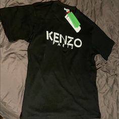 Authentic Kenzo Paris T-Shirt. Size: Medium. Condition: New With Tags Black Designer Logo Crew Neck Top, Black Crew Neck Top With Designer Logo, Black Crew Neck Tops With Designer Logo, Black Designer Logo Crew Neck T-shirt, Black Crew Neck T-shirt With Designer Logo, Designer Logo Crew Neck T-shirt For Streetwear, Black Designer Logo T-shirt For Streetwear, Black Cotton Tops With Designer Logo, Black Designer Logo Top For Streetwear