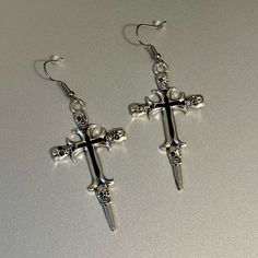 Black And Silver Skull Cross Gothic Earrings. *Brand New. *Length: 8cm Approximately. *Stainless Steel Hooks. *Zinc Alloy Cross Pendant Gothic Silver Earrings For Streetwear, Silver Metal Emo Earrings, Silver Metal Emo Style Earrings, Silver Emo Style Earrings, Nickel Free Silver Emo Earrings, Nickel-free Silver Emo Earrings, Silver Nickel-free Emo Earrings, Diamond Drop Necklace, Diamond Shape Earrings