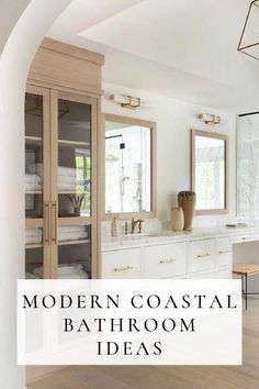 modern coastal bathroom with white cabinets and wood flooring is featured in the article, modern coastal bathroom ideas