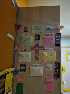 a bulletin board with many different types of mail on it