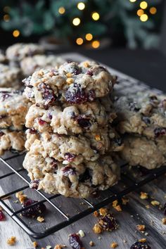 cranberry oatmeal cookies on a cooling rack next to a christmas tree