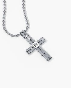 This handmade LA PAZ cross pendant was crafted in likeness of the LA PAZ ring. This pendant features 0.20 ct natural white or black diamonds and is available in both 14k gold, 18k gold and platinum. Customize your piece with any engraving your bold heart desires. This pendant is compatible with chains up to 2.5mm wide and is customizable with any engraving you can imagine. Chain sold separately. Silver Cross Jewelry With Single Cut Diamonds, White Gold Cross Pendant With Box Chain, Silver Cross Pendant Jewelry With Single Cut Diamonds, Diamond White Cross Pendant Necklace With Pave Setting, Diamond White Crystal Cross Pendant Necklace, Diamond Cross Pendant Jewelry With Polished Finish, Silver Cross Pendant With Single Cut Diamonds, Nickel-free White Gold Cross Pendant Jewelry, White Diamond-cut Pendant Cross Necklace