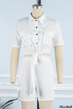 Olivia Mark - Womens Elegant White Two-Piece Casual Outfit Featuring a Stylish Solid Bandage Patchwork and Buckle-Accented Turndown Collar White Short Sleeve Sets With Pockets, White Sets With Pockets And Short Sleeves, White Fitted Jumpsuit With Tie Waist, White Fitted Jumpsuits And Rompers With Tie Waist, Fitted White Jumpsuits And Rompers With Tie Waist, White Short Sleeve Jumpsuits And Rompers For Work, Green Two Piece, 2piece Outfits, White Two Piece