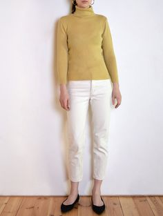 Cool vintage turtleneck blouse made of wool blend fabric with ribbed texture in muted yellow beige tone. Classic long sleeve body-hugging cut. Era: 90's, brand Elizabeth Shelton Fabric: 20% wool, 80% acrylic Condition: very good Estimated size: S / M (please, check the measurements) Measurements (measured flat, without stretching. Item is very stretchy): Chest: 44 cm / 17,3 inches Length: 60 cm / 23,6 inches Spring Turtleneck Sweater, Beige Turtleneck Top With Ribbed Collar, Spring Turtleneck With Ribbed Collar, Fine Knit Beige Turtleneck For Fall, Cream Turtleneck Tops With Ribbed Collar, Cream Turtleneck Top With Ribbed Collar, Beige Fitted Crew Neck Sweater, Beige Top With Ribbed Collar For Fall, Fitted Beige Crew Neck Sweater