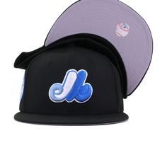 New Era Cap 59Fifty fitted hat for the Montreal Expos in black and blue colorway, featuring 1982 All Star Game side patch. We’ve taken our famous WAVE fitted and made a few revisions to make it even more fabulous. We’ve replaced Cerulean Blue with a softer Ultra Blue, which plays perfectly against the sharp Marine Blue embroidery. Our favorite part? The colors work perfectly in making the 1982 All Star Game side patch seem proportionate in size due to the two similar shades of blue playing so pe Blue Baseball Cap With Logo Patch, Blue Flat Bill Fitted Hat With Logo Patch, Blue Fitted Hat With Logo Patch And Flat Bill, Blue Baseball Cap With Logo Patch And Flat Brim, Blue Sports Fitted Hat With Logo Patch, Blue Snapback Fitted Hat For Streetwear, Blue Flat Brim Baseball Cap With Logo Patch, Blue Fitted Hat With Embroidered Logo For Streetwear, Throwback Flat Brim Fitted Hat For Streetwear