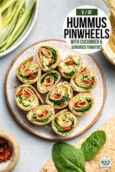 hummus pinwheels with cucumber and sun dried tomatoes on a plate