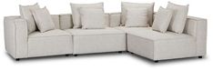 a white couch with lots of pillows on the top and bottom corner, sitting in front of a white background