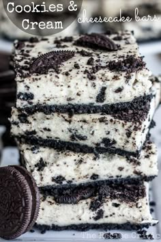 cookies and cream cheesecake bars stacked on top of each other with oreo cookies