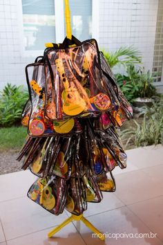 an umbrella made out of plastic bags on a stand