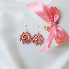 These pink earrings are made of high quality Japanese beads. They are suitable for both casual and evening looks. They are sure to make you stand out from the crowd. Dangle earrings are made in soft pink color, in the shape of a flower. The center is a Swarovski crystal, it shimmers and plays beautifully with its facets in the light. Buy these handmade earrings as a gift for your mom, daughter, sister or friend. The earrings are packaged in a beautiful gift box. You won't have to worry about pac Handmade Pink Crystal Earrings, Pink Beaded Crystal Drop Earrings, Pink Beaded Drop Crystal Earrings, Bead Cap Drop Earrings As Gift, Bead Cap Drop Earrings For Gift, Bead Caps Drop Earrings As Gift, Elegant Pink Crystal Earrings With Round Beads, Elegant Pink Beaded Earrings For Gift, Pink Elegant Beaded Earrings For Celebration