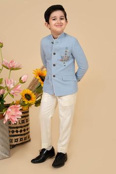 Sky blue full sleeves bandhgala in suiting base with placement bloom resham thread embroidery and faux pocket flaps detail. Paired with an off white pant. - Aza Fashions Embroidery Placement, Off White Pants, Boys Closet, White Pant, Online Closet, Thread Embroidery, Full Sleeves, White Pants, Aza Fashion