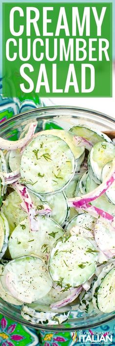 a bowl filled with cucumber salad on top of a blue and green table cloth