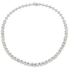 Finely crafted in platinum with round and marquise cut diamonds weighing a total of 18.56 carats. 16 1/2 inches long Wedding Platinum Marquise Necklace, Platinum Marquise Necklace For Wedding, Silver Marquise Cut Diamond Necklace For Formal Occasions, Platinum Marquise Necklace For Anniversary, Marquise Cut White Gold Diamond Necklace For Formal Occasions, White Gold Marquise Platinum Necklace, White Marquise Cut Diamond Necklace For Formal Occasions, White Marquise Cut Diamond Necklace For Formal Events, Pear Flower