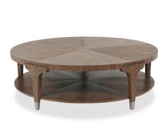 a round coffee table with two shelves on each side