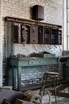 an old room with many pieces of furniture and tools on the table in front of it