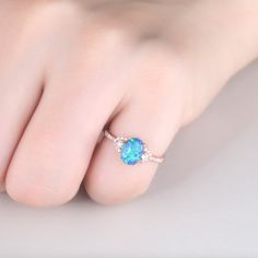 You are looking at a vintage Lab-created blue opal and diamond engagement ring.A perfect anniversary gift, birthday gift,wedding engagement ring. Ring Information Main Stone *Lab-created blue opal *6x8mm oval cut *Weight:it's approx 1.5 ct. *Setting: 4-prongs Side Stone *0.18 carat natural diamond Metal * Solid 10k 14k &18k. *Color:white gold,yellow gold,rose gold. Custom Order *The main stone can be other gemstones you can imagine,any birthstone can be made.Please contact me if you need thi Blue Oval Opal Ring Fine Jewelry, Oval Opal Ring With Accent Stones, Blue Oval Opal Ring Gift, Oval Opal Birthstone Ring, Wedding Ring Set Oval, Engagement Ring Diamond Band, Oval Opal Engagement Ring, Opal Wedding Ring Set, Opal Wedding Ring