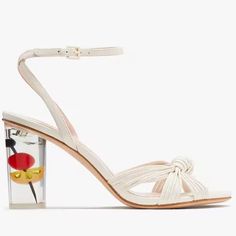 It’s Always Five O’clock Somewhere. Add A Twist To Your Happy Hour Style With This Strappy Sandal Set On A Whimsical Heel Featuring Colorful Cocktail Garnishes. Leather Upper, Lining And Sole. Kate Spade White Round Toe Heels, Kate Spade White Heels For Spring, Kate Spade White Open Toe Heels, Kate Spade White Summer Heels, Kate Spade Summer Sandals With Ankle Strap, Kate Spade Ankle Strap Sandals For Summer, Kate Spade Summer Ankle Strap Sandals, Kate Spade Open Toe Heels With Wrapped Heel, Chic White Kate Spade Heels