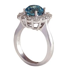 Stamped: 14K White GoldTotal Ring Weight: 6.5 GramsRing Length: N/ARing Width: N/AGemstone Weight: Total Natural Zircon Weight is 4.43 Carat (Measures: 8.21x8.23 mm)Color: BlueDiamond Weight: Total Natural Diamond Weight is 0.90 CaratColor: F-G, Clarity: VS2-SI1Face Measures: 13.42x13.67 mmSku: [702649W] Luxury 14k White Gold Brilliant Cut Topaz Ring, Luxury 14k White Gold Topaz Ring With Center Stone, Formal Birthstone Ring With Halo And Round Cut, Formal Emerald Ring With Halo And Round Cut, Formal Round Emerald Ring With Halo, Formal Emerald Ring With Halo, Luxury Cluster Halo Ring With Center Stone, Formal Emerald Halo Ring With Round Cut, Diamond And Topaz Gemstone Ring With Round Band