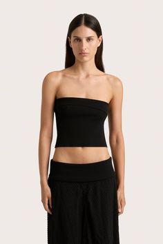 A strapless, ribbed knit top. Fitted around the bodice, it crops just above the waist and features a diagonal fold-over detail around the neckline. Style with the Ciele Maxi Skirt for transeasonal occasionwear or late night affairs. Chic Bandeau Tube Top In Elastane, Chic Bandeau Tube Top, Elegant Seamless Tube Top For Party, Elegant One Shoulder Crop Top For Evening, Elegant One-shoulder Crop Top For Evening, Elegant One-shoulder Evening Crop Top, Chic Bandeau Crop Top In Elastane, Chic Bandeau Crop Top, Strapless Elastane Tube Top For Night Out