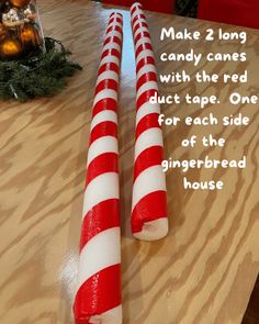 two candy canes sitting on top of a wooden table