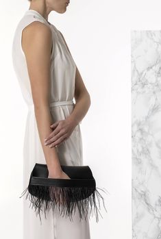 Bring a glamorous edge to your evening look with the Domna design black leather clutch Handmade of fine quality calf leather and silky feathers, this boho chic evening bag comes in 2 colors, black and camel brown (waxed tan). ● Size: width 29 x height 16cm (width 11.4 x height 6.3 inches) ● Without lining ● Dust bag included Discover the whole collection with our unique leather bags: www.etsy.com/shop/GreekChicHandmades?ref=seller-platform-mcnav&section_id=15827194 Back to the shop: www.etsy.com/shop/GreekChicHandmades SHIPPING Every clutch is handmade upon order and ready to be shipped in 3-7 business days. We ship from Greece to all over the world via DHL express with delivery time 1-5 business days.  Please be aware that delivery may experience delays due to your country's customs proce Black Leather Evening Pouch, Black Clutch With Detachable Strap For Formal Events, Modern Black Pouch For Formal Occasions, Black Leather Pouch Clutch, Black Leather Clutch For Formal Occasions, Chic Evening Clutch With Removable Pouch, Elegant Black Clutch With Detachable Strap, Modern Black Clutch For Formal Occasions, Elegant Leather Evening Clutch