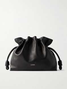 According to our buyers, slouchy bags are one of this season's most sought after styles and Loewe's understated 'Flamenco' clutch is the perfect way to tap into the trend. Crafted in Spain from supple leather and lined in suede, it's detailed with knotted drawstring ties to create a scrunched top and embossed with the label's 'Anagram' logo. Carry your cardholder, keys and phone inside, and attach the strap to go hands-free. Loewe Flamenco Black, Loewe Puffer Goya Bag, Slouchy Bags, Loewe Flamenco Clutch, Loewe Flamenco, Slouchy Bag, Black Leather Clutch, Raffia Bag, Watch Gifts