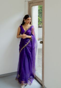 Meenakshi Silk Organza Saree Set. Its a beautiful hand embroidered pure silk organza saree in purple color which is so versatile & classy that you can wear it at any function or occasion. (Set of 2). Material & Composition: Saree in Silk Organza, Blouse in Raw Silk in Amethyst purple color. Zardozi Hand embroidery, organic dying, textile manipulation Sizing: Once your order is placed, we'll promptly reach out to you via email or WhatsApp to gather all the necessary measurements for the best fit. Simple Sarees Classy Beautiful, Simple Saree Look For Function, Simple Saree Look Classy, Classy Saree Look, Classy Saree, Elegant Saree Classy, Simple And Elegant Saree Look, Purple Sarees, Embroidered Saree