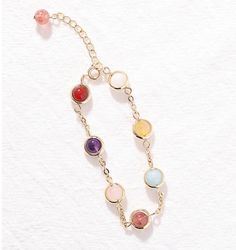 This exquisite multicolor stone bracelet is crafted from a combination of the finest materials and with the utmost care. The vibrant colors give it a luxurious and sophisticated feel, ensuring it will be a striking addition to any outfit. Perfect for adding a touch of glamour to special occasions. Elegant Rainbow Round Bracelets, Adjustable Rainbow Gemstone Bracelet, Trendy Multicolor Chain Bracelet For Gift, Trendy Multicolor Adjustable Chain Bracelet, Multicolor Round Beads Metal Jewelry, Multicolor Bangle Charm Bracelet For Party, Elegant Rainbow Bracelets For Parties, Elegant Crystal Bangle Bracelet With Natural Stones, Trendy Adjustable Multicolor Chain Bracelet