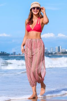 The Red Geo Tapered Leg Cover-Up Pants feature a striking geometric pattern in bold red, offering a stylish way to transition from the seaside to the boardwalk. Product code: CAA07C4E008DJ Features:  Woven Tie waist Tapered leg Pattern: GEO Material: 100%POLYESTER. Red Bohemian Bottoms For Vacation, Bohemian Red Bottoms For Vacation, Red Tie-side Bottom Beachwear, Red Bohemian Pants For Beach, Bohemian Red Pants For Beach, Casual Red Beach Pants, Red Bohemian Pants For The Beach, Bohemian Red Pants For The Beach, Beachy Red Bottoms For Summer