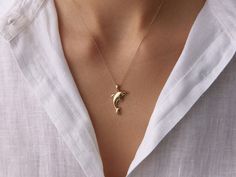 This 14K gold dolphin necklace is a stunning and elegant accessory that blends modern style with timeless charm. Perfect for daily wear or special occasions, it's an ideal gift for women who appreciate quality and elegance. 🌊✨ Crafted with care, this necklace will surely become a cherished piece in any jewelry collection. High-Quality Craftsmanship: Each necklace is meticulously crafted for durability and beauty, ensuring long-lasting quality. 14K Yellow Gold: Made with genuine 14K gold, offeri Dolphin Necklace, Special Occasion Jewelry, Whimsical Jewelry, Gold Necklace Women, 14k Gold Necklace, Elegant Accessories, Jewelry For Her, Beautiful Gift Boxes, Gold Pendant