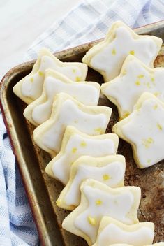 a baking pan filled with cut out cookies