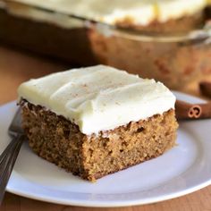 a piece of carrot cake on a white plate