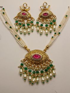 Amdavadi pachi kundan necklace set beautifully intricated with pearl and emerald green coloured drop shaped beads with pearl jumkis Traditional Green Jewelry With Dori Work, Green Dori Work Jewelry For Diwali, Traditional Green Dori Work Jewelry, Festival Kundan Temple Necklace With Pearl Drop, Festive Kundan Temple Necklace With Pearl Drop, Green Pearl Necklace With Meenakari For Festivals, Green Meenakari Pearl Necklace For Festivals, Kundan Chandbali Necklace With Pearl Drop, Chandbali Kundan Necklace With Pearl Drop