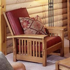 a wooden chair sitting in front of a fireplace