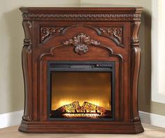 an ornate fireplace with the lights on