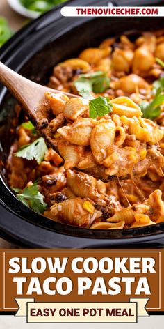 the slow cooker taco pasta is ready to be eaten with a wooden spoon