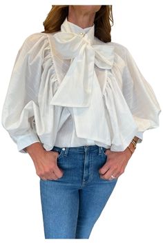 The absolute blouse for a very ethereal look. It comes in a delicate cotton voile and you can wear it with or without a romantic bow. Composition: 100% Cotton Chic White Blouse With Tie Sleeves, White Blouse With Tie Sleeves For Daywear, Chic Summer Top With Detachable Bow, Chic Tops With Detachable Bow For Summer, Elegant Spring Tops With Detachable Bow, Chic Summer Tops With Detachable Bow, Elegant Tops With Detachable Bow For Spring, Chic Tops With Detachable Bow For Spring, Chic White Blouse With Bow