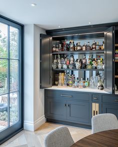 a home bar with lots of bottles on the shelves