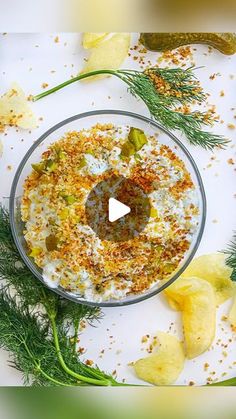 an appetizer is garnished with herbs and seasoning in a glass bowl