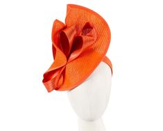 Large orange twisted plate decorated with silk abaca bow. Hand made in Melbourne by our skillful milliners, this headpiece will be a crown jewel of your spring racing outfit.  Made in Australia  Exclusive materials  Stylish design by Fillies Collection  Comfortable headband Orange Headpiece For Kentucky Derby Races, Orange Headpieces For Kentucky Derby Races, Orange Fitted Headpiece For Kentucky Derby, Orange Mini Hat For Kentucky Derby Races, Elegant Orange Headpiece For Spring, Orange Fascinator For Spring Races, Orange Spring Fascinator For Races, Orange Spring Races Fascinator, Spring Races Orange Fascinator