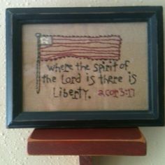 a cross stitch picture with the words where the spirit of the lord is there is liberty