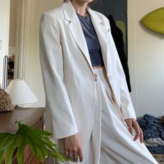 Gorgeous Ivory Pantsuit. Wide Leg, Flowy Pants With A Flattering Waistline. Laudine Single-Button Blazer. New With Tags! Never Been Worn. Willing To Sell Top And Bottom Separately, But They Do Belong Together! Would Be Perfect For A Bridal Shower, Rehearsal Dinner, A Night On The Town, Anything. Super Flattering And Comfortable. Pants Flat Waist - 12.5 Inch Inseam - 28 Inch Jacket Flat Ptp - 18.5 Inch Length - 28 Inch Chic White Suits With Button Closure, Classic Beige Pantsuit For Office, Classic Beige Office Pantsuit, Chic Beige Notch Lapel Pantsuit, Chic Beige Pantsuit With Notch Lapel, White Office Suits With Buttons, Elegant Cream Pantsuit For Work, White Office Suit With Button Closure, Chic Beige Single-breasted Suit