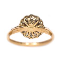 * VIEW A VIDEO OF THIS RING * https://youtu.be/bY0Fhm3gsck Description: Here we have a gorgeous Edwardian Era 14 karat yellow gold ring with a platinum head. It is absolutely beautiful, featuring a GIA certified .55ct center stone. It has been well kept and well preserved throughout so many years. The floral setting featuring .15cttw diamonds around the center is what makes this ring so unique! We are amazed at the condition of the ring as well as it's unique design! This piece is accompanied wi Victorian Style Round Diamond Ring Stamped 14k, Yellow Gold Diamond Halo Ring Stamped 14k, Yellow Gold Halo Ring With Diamond, Stamped 14k, Antique Brilliant Cut Yellow Gold Diamond Ring, Antique Yellow Gold Brilliant Cut Diamond Ring, Antique Brilliant Cut Diamond Ring In Yellow Gold, Antique Yellow Gold Diamond Ring With Round Cut, Timeless Yellow Gold Halo Ring With Rose Cut Diamonds, Yellow Gold Cluster Ring With Rose Cut Diamonds