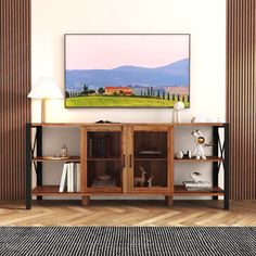 a living room scene with focus on the entertainment center and mountains in the back ground