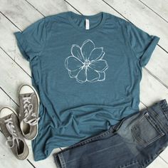 Our shirts are handmade in Ohio by hand with love and care one at a time. We hope you will find a shirt that will inspire you or someone else. DESCRIPTION: Magnolia, Magnolia Shirt, Floral Tee, Magnolia Tee, Wildflower Shirt, Boho Shirt, Garden Shirt, Magnolia Tshirt, Summer Shirt, Flower Shirt This cute magnolia tee is a must. We use a high-quality unisex t-shirt that is insanely soft. In fact, it will be one of the softest, best fitting, most comfortable shirts you've ever owned. CLICK BELOW h Garden Shirt, Wildflower Shirt, Single Shirt, Sunflower Shirt, Boho Shirt, Gardening Shirts, Floral Tee, Boho Shirts, Flower Shirt