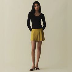 In Buttery Garment-Washed Silk Satin, The Giuletta Skirt Is A Favorite Of Our Co-Founders Margaret And Katherine. It Features A High Waist Trimmed With Delicate Scallop Elastic, An A-Line Cut, And A Bias-Cut Hemline. Chic Fitted Yellow Skirt, Elegant Yellow Mini Skirt For Spring, Elegant Yellow Skirted Bottoms, Yellow Flared Skirt For Fall, Chic Yellow Mini Skort, Chic Yellow Mini Skirt For Work, Elegant Yellow Flared Skirt, Elegant Yellow Mini Skirt For Summer, Yellow Flared Workwear Skirt