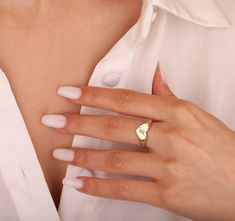 "14k Gold Heart Ring / Handcrafted Initial Heart Ring / Personalized Heart Ring / Delicate Gold Ring / Gold Heart Ring / Heart Signet Ring Made To Order 14k Rose Gold (if you want 18K please send a message) Special Gold Color: Rose Gold, Yellow Gold, White Gold PROPERTIES: 💎Bandwidth: 2.93 mm 💎Width: 8.64 mm 💎Height: 1.77 mm If you want a different font, please contact us. Optionally, a name or letter can be written in the middle of the heart on the ring. 💗Follow on INSTAGRAM @gnydiamond If you have any additional questions about this product, just hit the \"Ask a Question\" button (just to the right of the price) and we will get back you within a few hours. Be sure to hit \"favorite\" on the right so it remains in your favorites list and / or add to your wishlist (s) ▶ Want to find ou Gold Properties, Heart Signet Ring, Delicate Gold Ring, Gold Heart Ring, Ring Heart, Bracelets Gold Diamond, Favorites List, Delicate Rings, Gold Heart